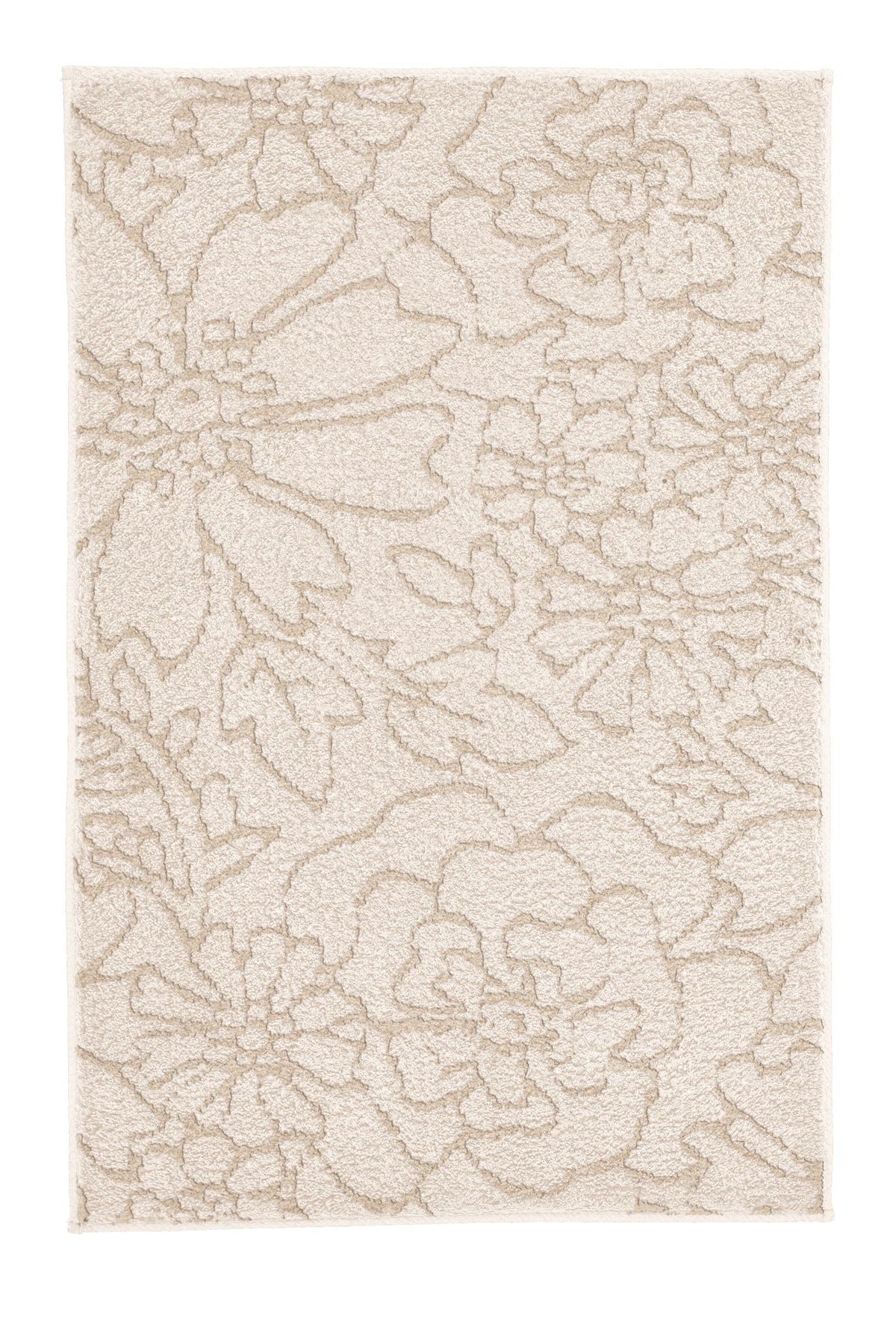Cremefarbiger Badteppich mit floralem Reliefmuster.