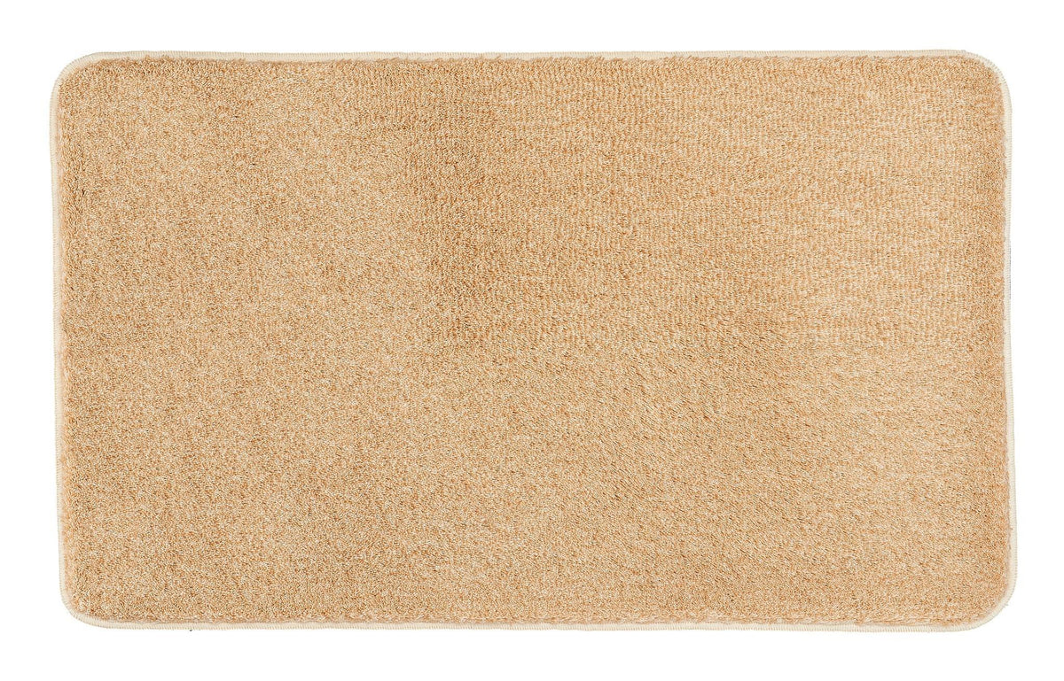 Rechteckige beige Badematte mit weicher, dichter Textur von oben gesehen
