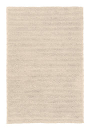 Rechteckiger, hochfloriger Badteppich in hellem Beige von oben gesehen