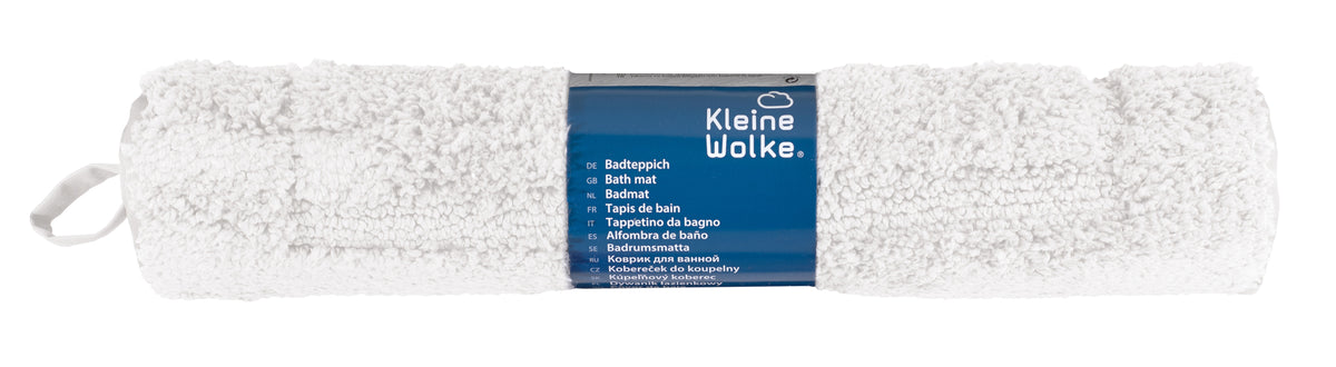 Zusammengerollter weißer Badteppich mit blauem Etikett Kleine Wolke