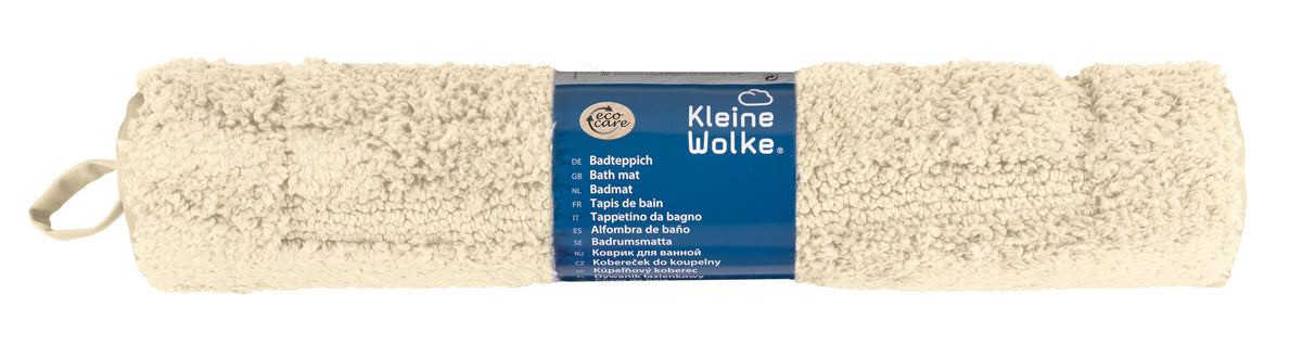Aufgerollter cremefarbener Badteppich mit blauem Kleine-Wolke-Etikett