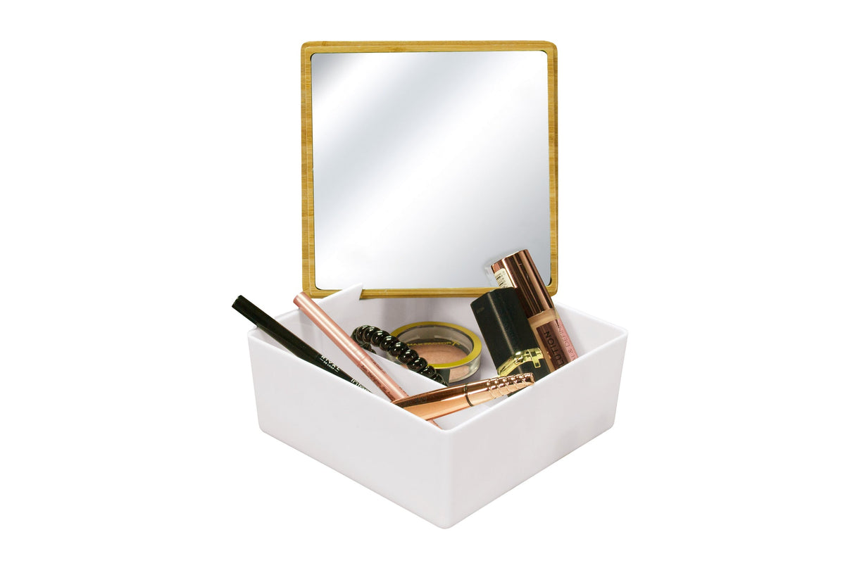Weiße Schmuckdose mit goldenem Spiegeldeckel und Make-up-Utensilien