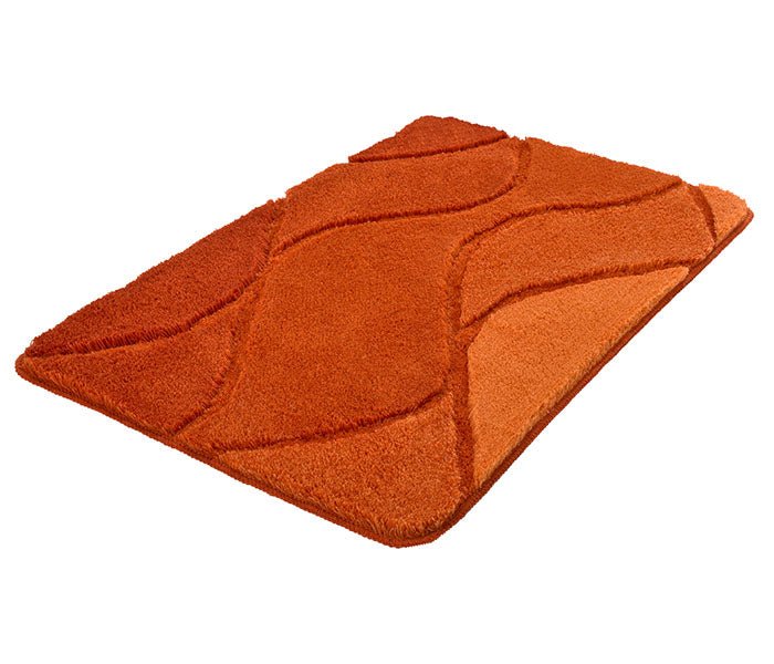Oranger Badematte mit Wellenmuster in verschiedenen warmen Orangetönen