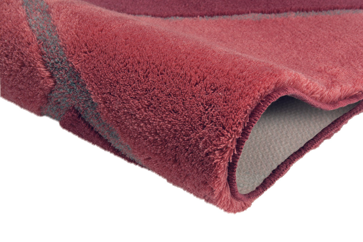 Roter Badteppich mit grauer Musterung und rutschfester Rückseite unten