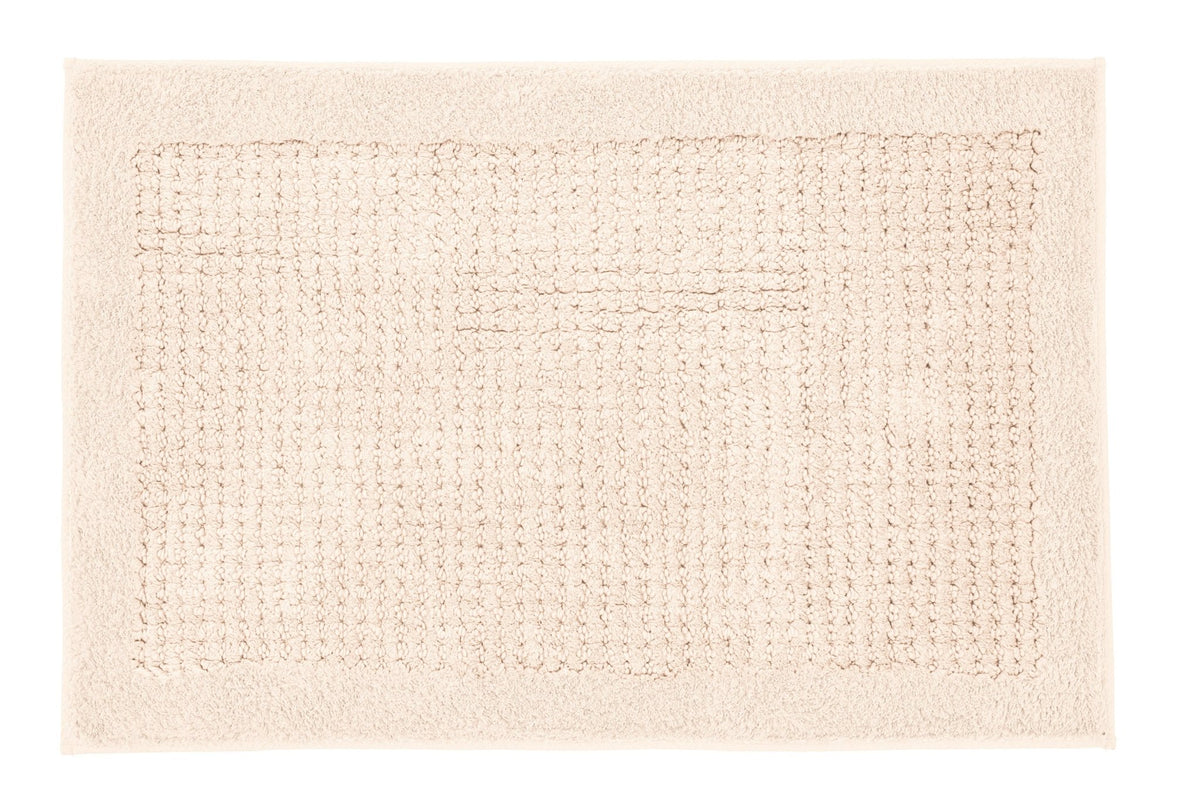 Rechteckige beige Badematte mit strukturiertem Feld in der Mitte