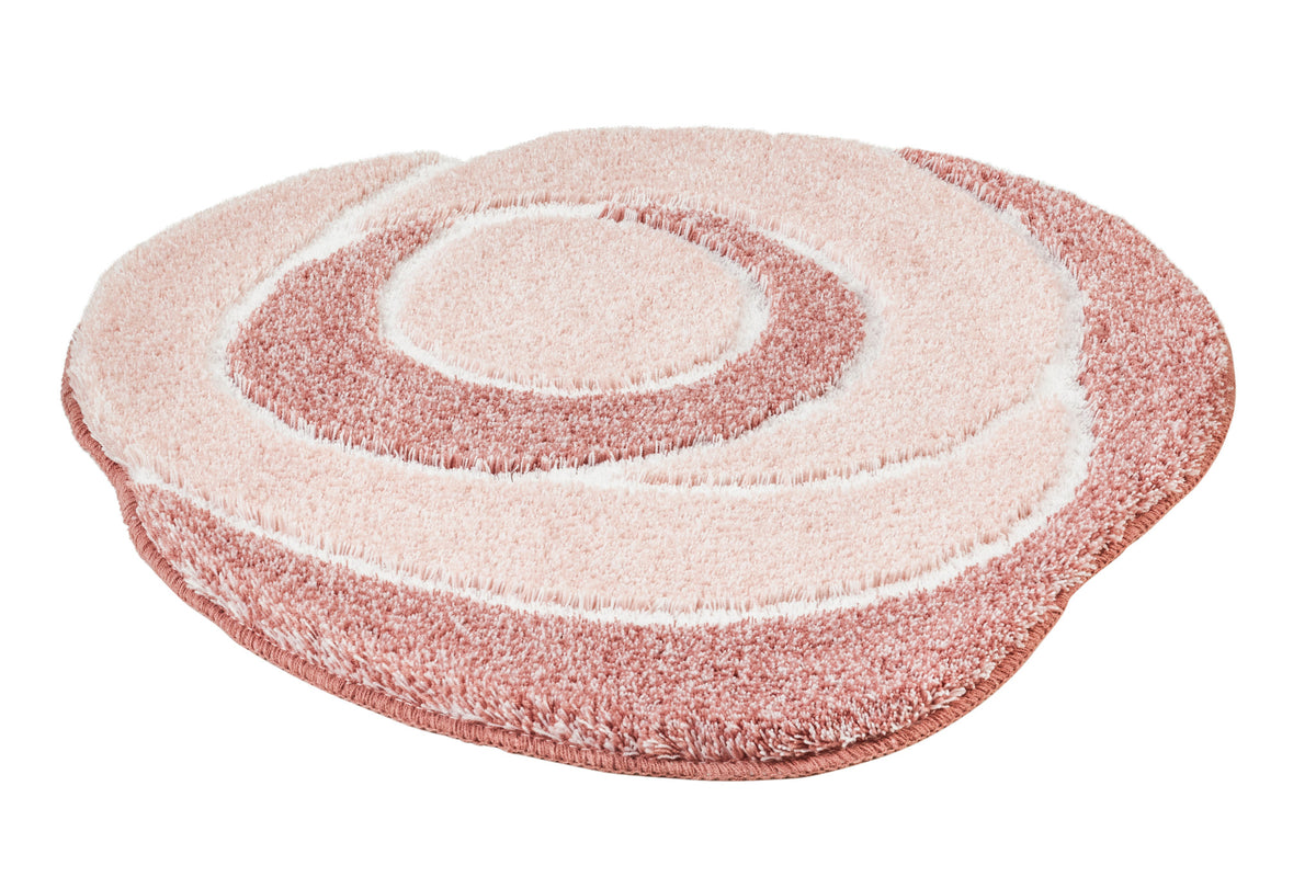 Runder rosa Badteppich mit kreisförmigem Muster in Hellrosa und Rosé.