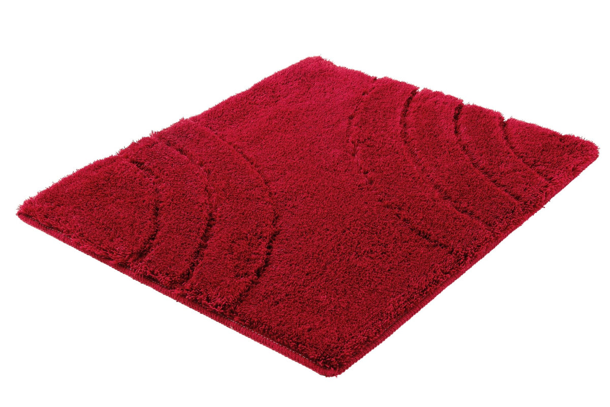 Rechteckiger roter Badteppich mit hochflorigem, gemusterter Oberfläche