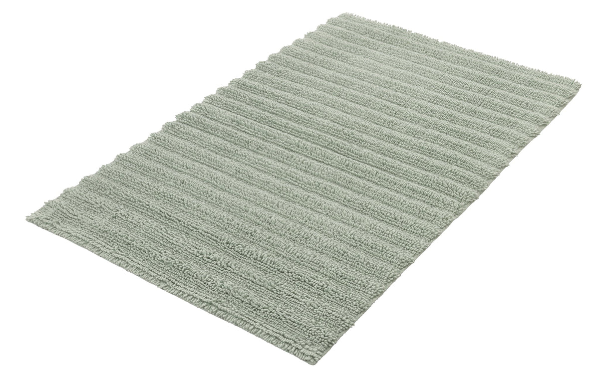 Rechteckige, hellgrüne Badematte mit fein gerippter Oberfläche aus Stoff