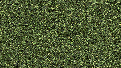 Nahaufnahme einer weichen, grün strukturierten Badematte aus Textil