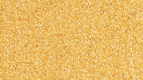 Nahaufnahme eines dichten, goldgelben Badteppich-Flors aus Textil